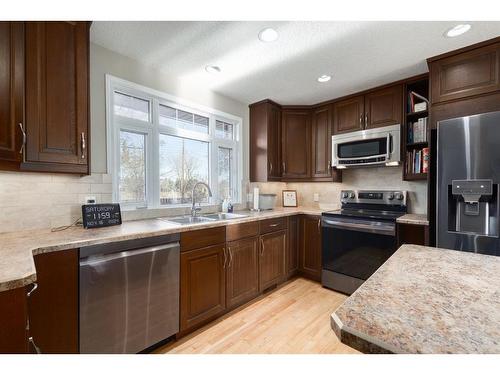 204 Doverthorn Close Se, Calgary, AB - Indoor Photo Showing Kitchen With Double Sink