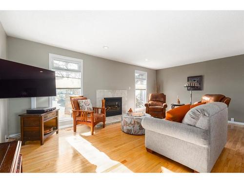 204 Doverthorn Close Se, Calgary, AB - Indoor Photo Showing Living Room With Fireplace