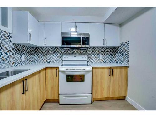 180 Fallswater Road Ne, Calgary, AB - Indoor Photo Showing Kitchen