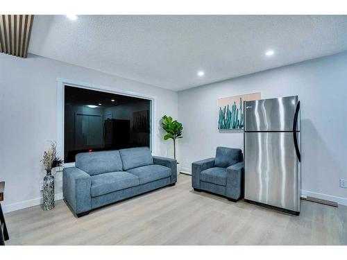 180 Fallswater Road Ne, Calgary, AB - Indoor Photo Showing Living Room