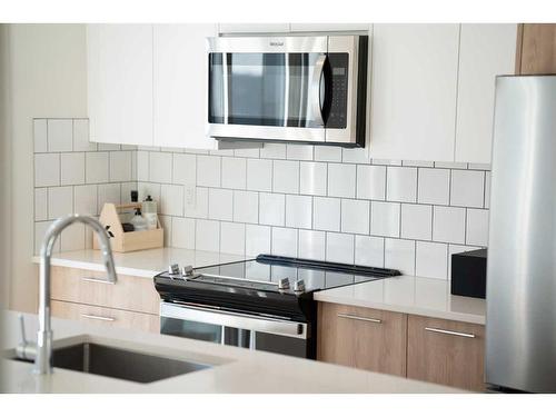 504-857 Belmont Drive Sw, Calgary, AB - Indoor Photo Showing Kitchen With Double Sink With Upgraded Kitchen