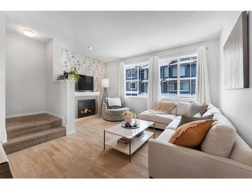 26 Kinlea Common Nw, Calgary, AB - Indoor Photo Showing Living Room With Fireplace