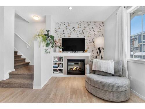 26 Kinlea Common Nw, Calgary, AB - Indoor Photo Showing Living Room With Fireplace