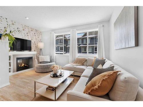 26 Kinlea Common Nw, Calgary, AB - Indoor Photo Showing Living Room With Fireplace