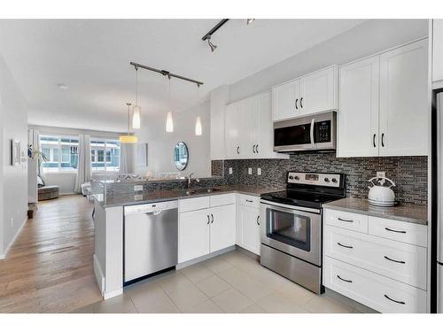 26 Kinlea Common Nw, Calgary, AB - Indoor Photo Showing Kitchen With Stainless Steel Kitchen With Double Sink With Upgraded Kitchen