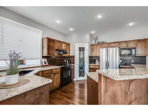 120 Bayside Point Sw, Airdrie, AB - Indoor Photo Showing Kitchen With Double Sink