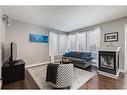 120 Bayside Point Sw, Airdrie, AB  - Indoor Photo Showing Living Room With Fireplace 