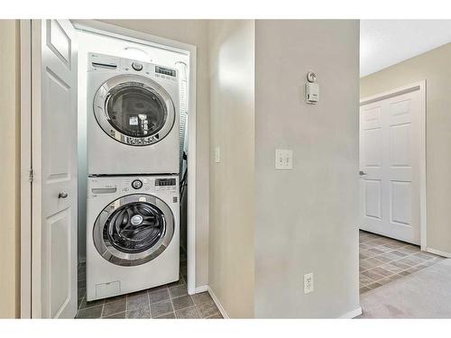 1302-200 Community Way, Okotoks, AB - Indoor Photo Showing Laundry Room