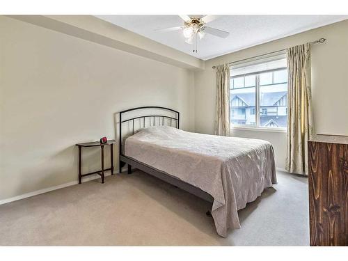 1302-200 Community Way, Okotoks, AB - Indoor Photo Showing Bedroom