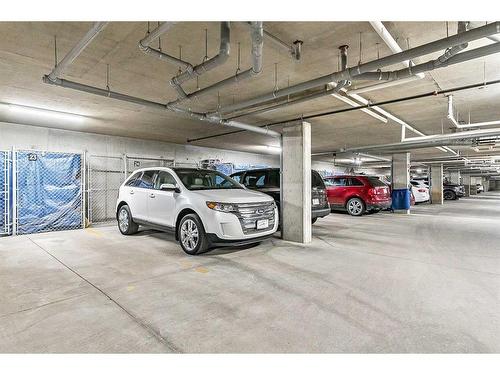 1302-200 Community Way, Okotoks, AB - Indoor Photo Showing Garage