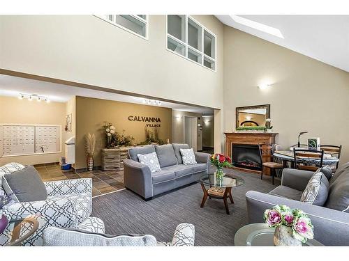 1302-200 Community Way, Okotoks, AB - Indoor Photo Showing Living Room With Fireplace