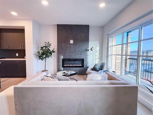 93 Arbour Lake Court Nw, Calgary, AB - Indoor Photo Showing Living Room With Fireplace