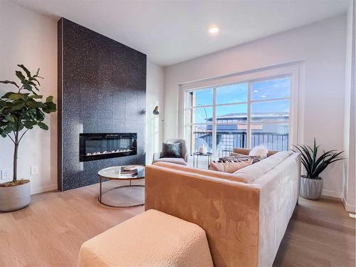 93 Arbour Lake Court Nw, Calgary, AB - Indoor Photo Showing Living Room With Fireplace