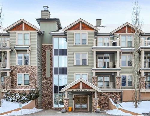 108-205 Sunset Drive, Cochrane, AB - Outdoor With Facade