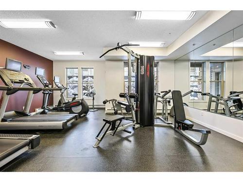 108-205 Sunset Drive, Cochrane, AB - Indoor Photo Showing Gym Room