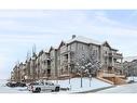 108-205 Sunset Drive, Cochrane, AB  - Outdoor With Facade 