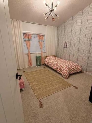 332 South Harmony Drive, Rural Rocky View County, AB - Indoor Photo Showing Bedroom