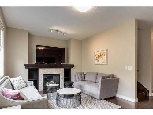 114 Sherwood Mount Nw, Calgary, AB - Indoor Photo Showing Living Room With Fireplace