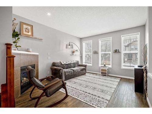 147 Auburn Bay Crescent Se, Calgary, AB - Indoor Photo Showing Living Room With Fireplace