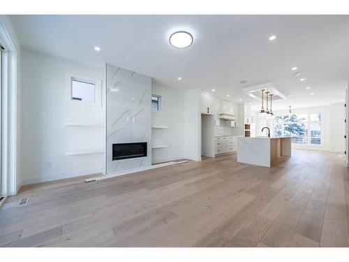 31 Harvard Street Nw, Calgary, AB - Indoor Photo Showing Other Room With Fireplace