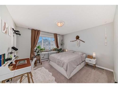 17 Belgian Lane, Cochrane, AB - Indoor Photo Showing Bedroom