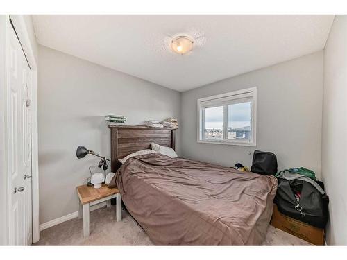 17 Belgian Lane, Cochrane, AB - Indoor Photo Showing Bedroom