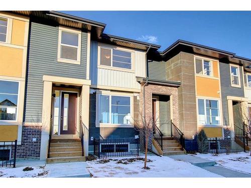 310 Sundown Road, Cochrane, AB - Outdoor With Facade