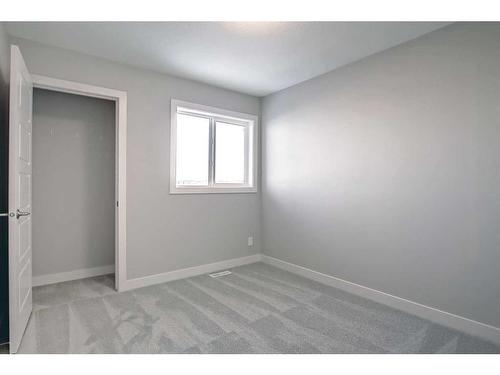 310 Sundown Road, Cochrane, AB - Indoor Photo Showing Other Room