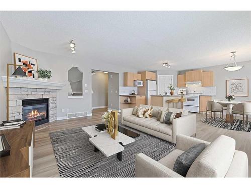 46 Chapman Close Se, Calgary, AB - Indoor Photo Showing Living Room With Fireplace