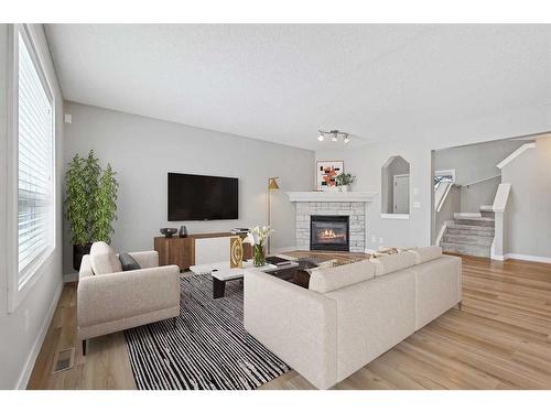 46 Chapman Close Se, Calgary, AB - Indoor Photo Showing Living Room With Fireplace