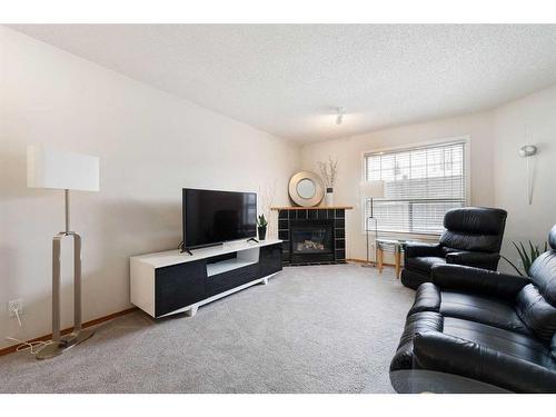 178 Mt Aberdeen Manor Se, Calgary, AB - Indoor Photo Showing Living Room With Fireplace