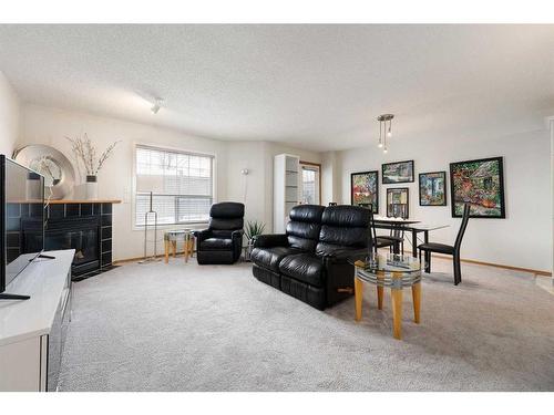 178 Mt Aberdeen Manor Se, Calgary, AB - Indoor Photo Showing Living Room With Fireplace