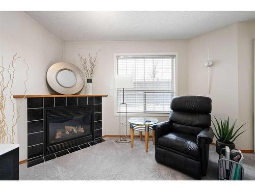 178 Mt Aberdeen Manor Se, Calgary, AB - Indoor Photo Showing Living Room With Fireplace