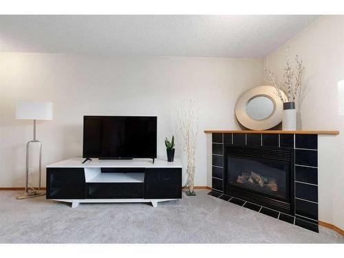 178 Mt Aberdeen Manor Se, Calgary, AB - Indoor Photo Showing Living Room With Fireplace