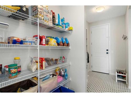 543 Belmont Heath Sw, Calgary, AB - Indoor With Storage