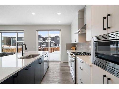 543 Belmont Heath Sw, Calgary, AB - Indoor Photo Showing Kitchen With Double Sink With Upgraded Kitchen