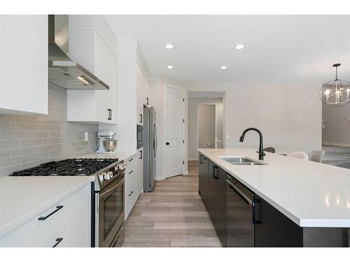 543 Belmont Heath Sw, Calgary, AB - Indoor Photo Showing Kitchen With Double Sink With Upgraded Kitchen