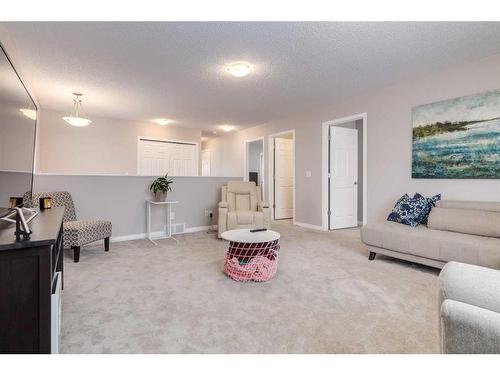 2 Evansbrooke Manor Nw, Calgary, AB - Indoor Photo Showing Living Room