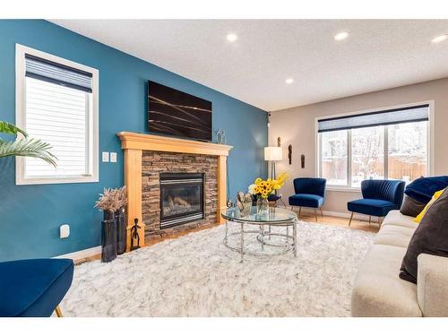 2 Evansbrooke Manor Nw, Calgary, AB - Indoor Photo Showing Living Room With Fireplace