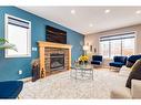 2 Evansbrooke Manor Nw, Calgary, AB  - Indoor Photo Showing Living Room With Fireplace 