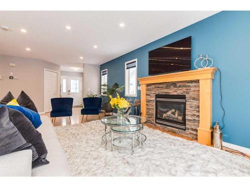 2 Evansbrooke Manor Nw, Calgary, AB - Indoor Photo Showing Living Room With Fireplace