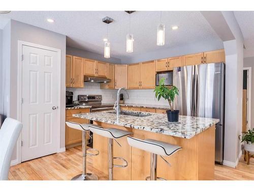 2 Evansbrooke Manor Nw, Calgary, AB - Indoor Photo Showing Kitchen With Stainless Steel Kitchen With Double Sink