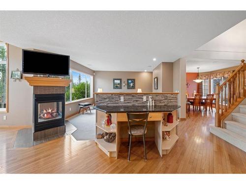 82 Everwillow Close Sw, Calgary, AB - Indoor With Fireplace