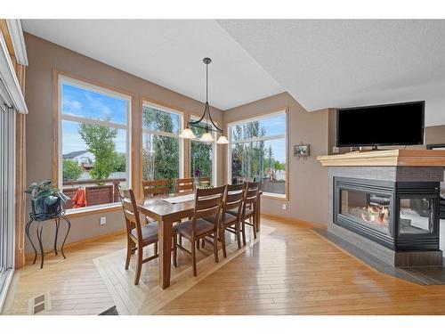 82 Everwillow Close Sw, Calgary, AB - Indoor Photo Showing Other Room With Fireplace