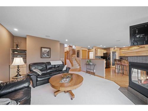 82 Everwillow Close Sw, Calgary, AB - Indoor Photo Showing Living Room With Fireplace