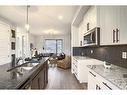 51 Lambeau Lane Se, Airdrie, AB  - Indoor Photo Showing Kitchen With Double Sink With Upgraded Kitchen 