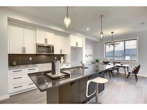 51 Lambeau Lane Se, Airdrie, AB - Indoor Photo Showing Kitchen With Upgraded Kitchen