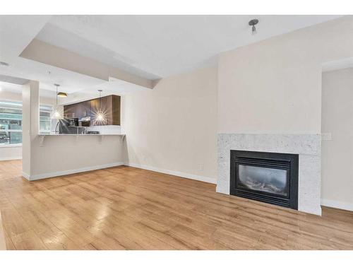 114-830 Centre Avenue Ne, Calgary, AB - Indoor Photo Showing Living Room With Fireplace