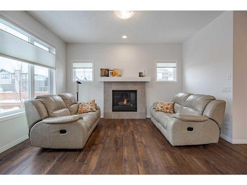 401 Clydesdale Way, Cochrane, AB - Indoor Photo Showing Living Room With Fireplace