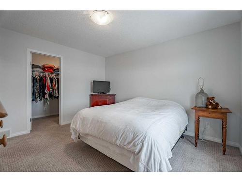 401 Clydesdale Way, Cochrane, AB - Indoor Photo Showing Bedroom